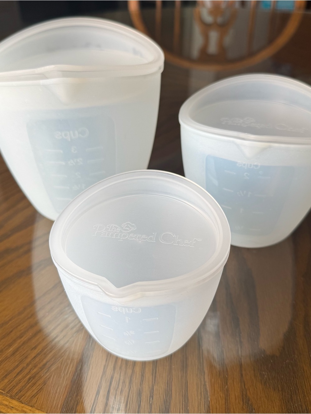 The Pampered Chef Silicone Nesting Measuring Cup Set with Lids (3-Piece)